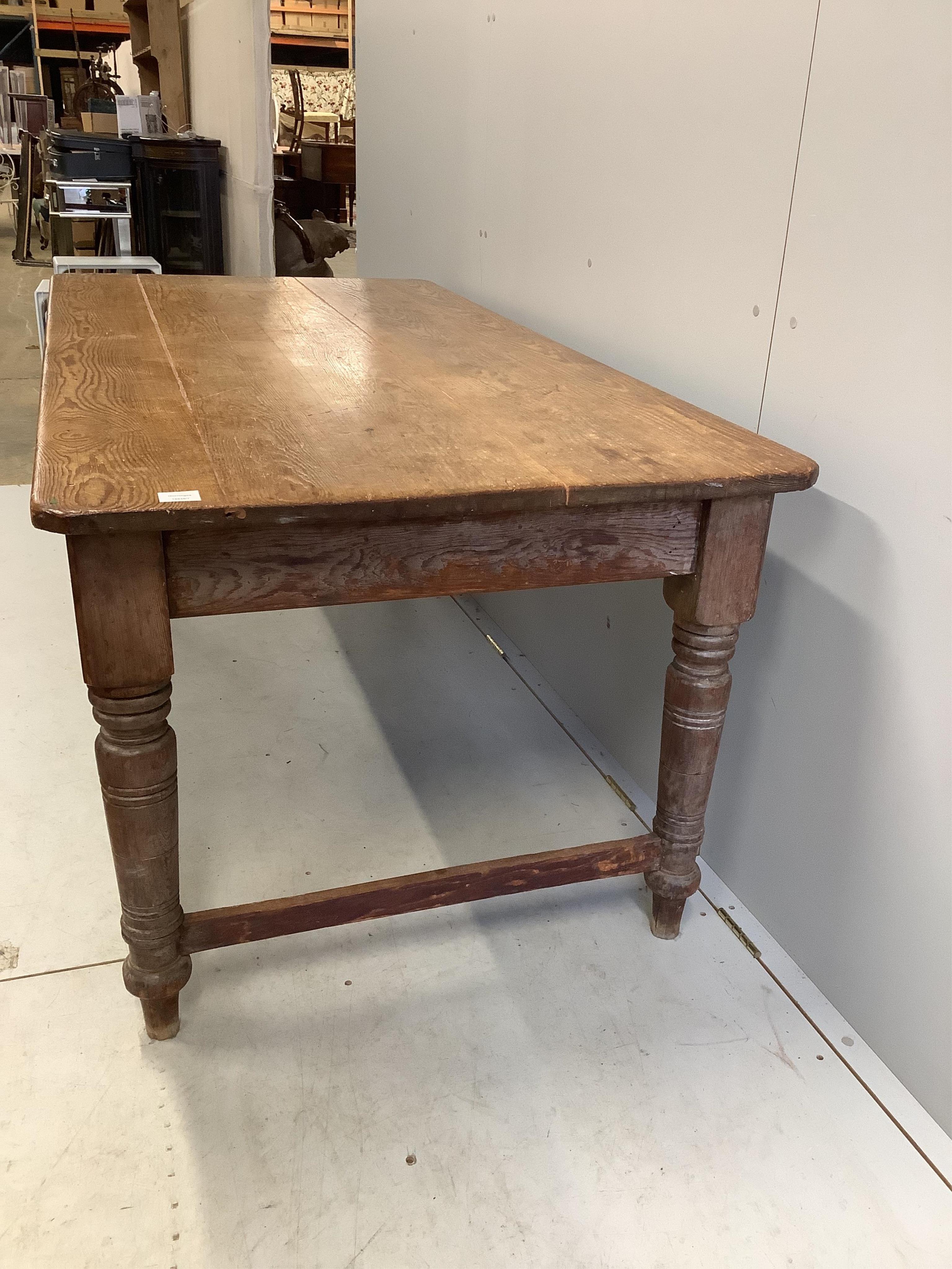 A Victorian rectangular pitch pine kitchen table, width 183cm, depth 90cm, height 75cm. Condition - fair